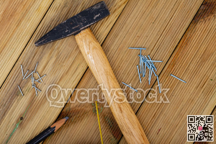 Hand hammer for building works on wooden table