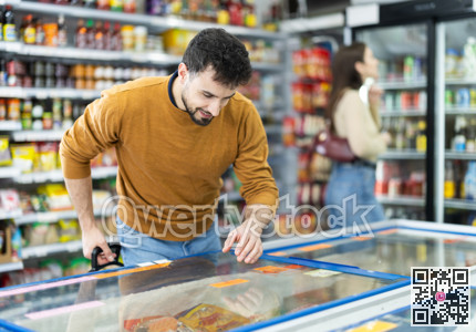 Man spends time in store, looking for necessary goods and get out from refrigerator