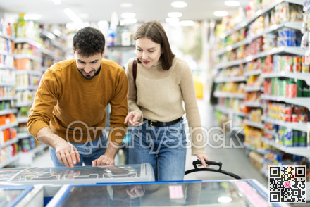 Couple spends time in store, looking for necessary goods and get out from refrigerator