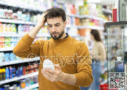 Man spends time in store, looking for goods and select care product