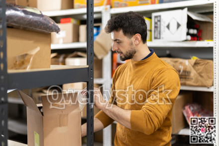 Positive worker loading box at warehouse store