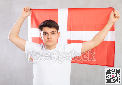 Guy holding the Danish flag in her hands