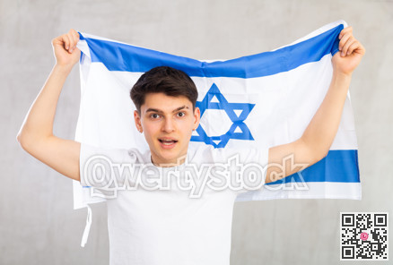 Guy holding the Israel flag in her hands