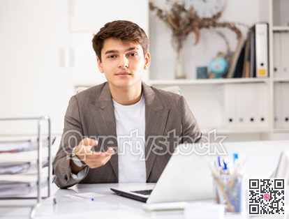 Businessman offerring hand for greeting in office interior