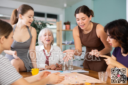 Female colleagues playing board game