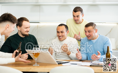 Group of football fans drinking beer and watching football match on laptop at home
