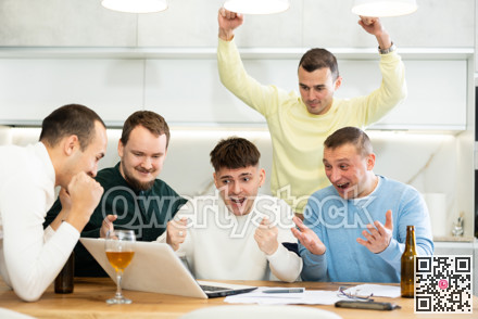 Group of football fans drinking beer and watching football match on laptop at home