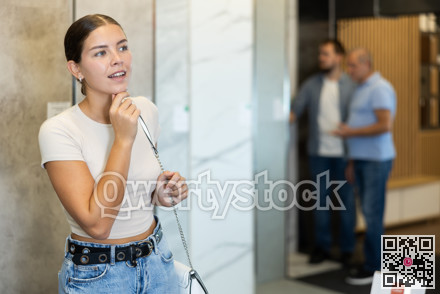 Young woman looking around in building store