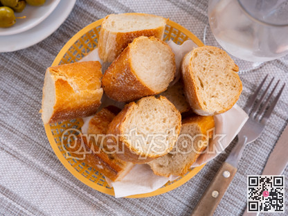 Bread sliced and served on table