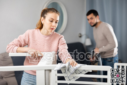 Wife and husband cleaning up in apartment