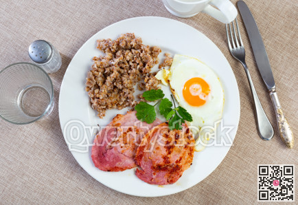 Pork with buckwheat and fried eggs for breakfast