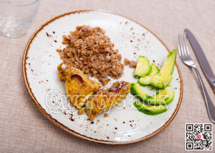 Tender meat of fried chicken meat is garnished with boiled buckwheat