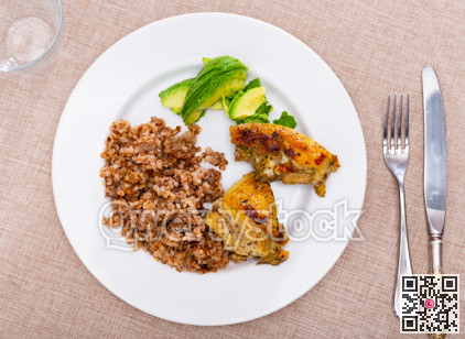 Tender meat of fried chicken meat is garnished with boiled buckwheat