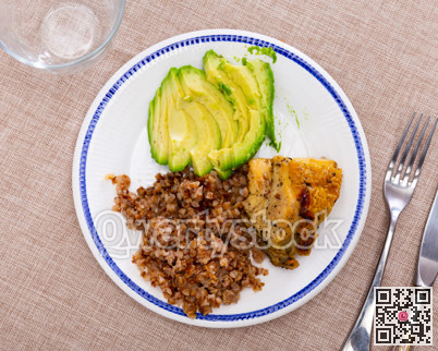 Tender meat of fried chicken meat is garnished with boiled buckwheat