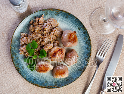 Delicious roasted turkey breast with buckwheat porridge on table