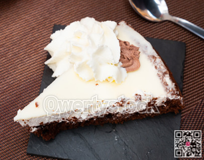 Tasty dessert chocolate cake on saucer with chocolate topping