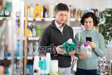 Couple man and woman scanning qr code for detergent