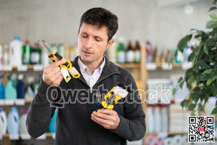 Adult man holding tools in his hands