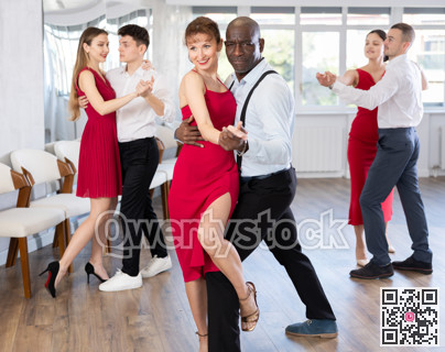 Adult man and adult woman dance tango