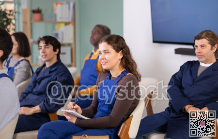 Portrait of an attentive young female worker on refresher course