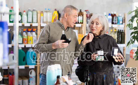 Husband and wife choose cosmetics and perfume together in supermarket