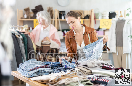 woman chooses jeans against the background of an elderly customer