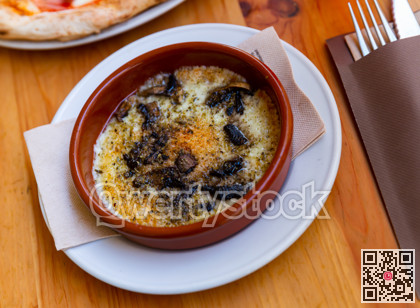 Provolone cheese baked with mushrooms seasoned with Italian herbs