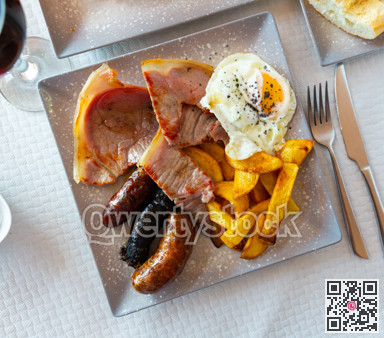 Fried pork with assorted Spanish sausages and potatoes