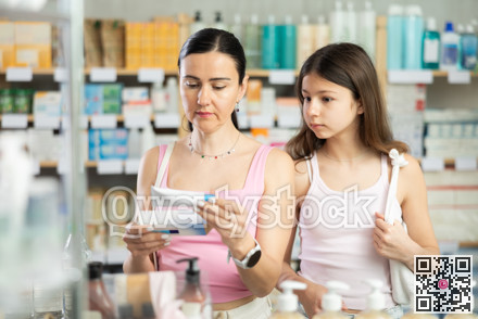 Mother with teenage daughter choosing an ointment
