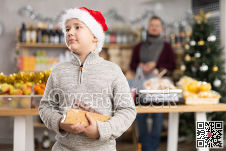 Boy in Santa hat with nougat