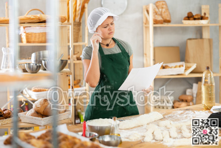 Girl baker looks at piece of paper, reads recipe, specifies number of ingredients for making dough