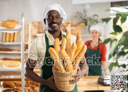 Portrait of positive man bakery worker