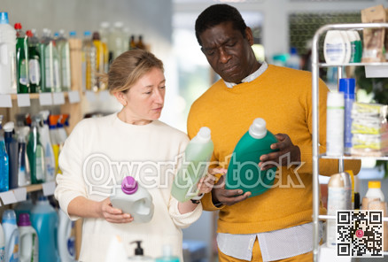 Before buying in household shop, couple choose liquid detergent