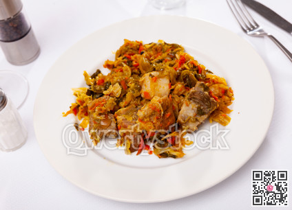 Appetizing cabbage stewed with pork meat on plate