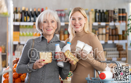 Girl and grandma with dairy products chooses something else, examines labels of cheese and yogurt