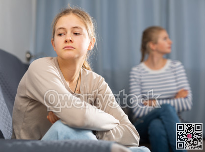 Mother soothes teen daughter after an quarrel
