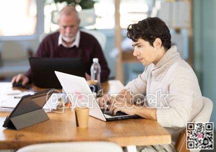 Office male employees working with laptop or computer
