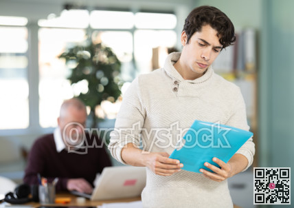Guy office male employee read documents