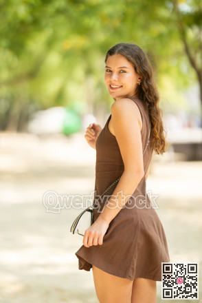 Woman walking in the park in summer