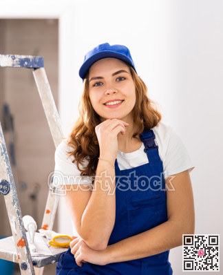 Woman builder standing in apartment