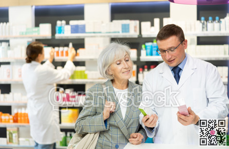 Middle-aged male pharmacist consulting old woman costumer about care product in box
