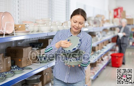 Woman customer chooses soup tureen