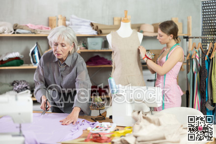 Woman Tailor Cuts Material