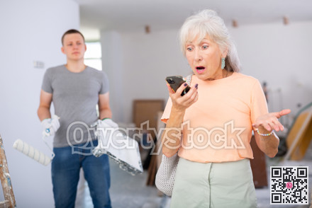 Emotional mature woman discusses current issues on a mobile phone