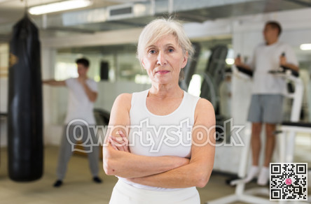 Portrait of mature woman in gym for self defense exercises