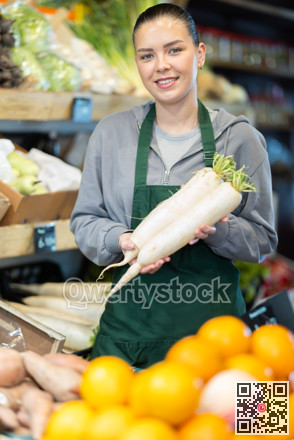 Farm shop owner offering organic radishes