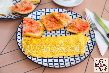 Fried rolled omelette with toast and vegetable sauce