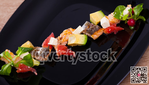 Salad with fried trout, avocado, grapefruit, soft cheese, cornsalad