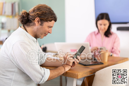 Managers use smartphone during meeting or conference. look at screen of phones