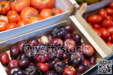 Eco products store counter with large assortment of tomatoes for salent